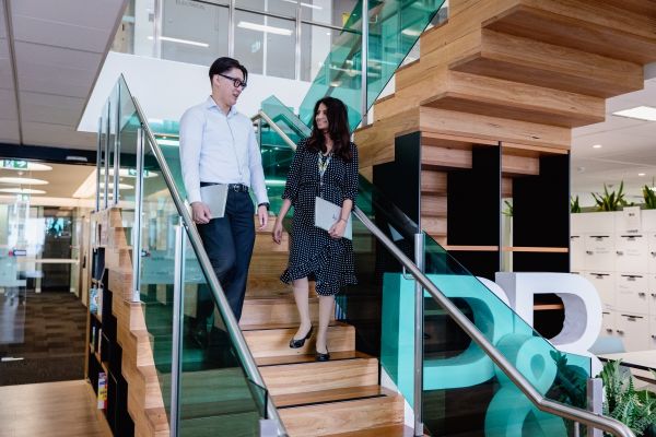 NSW Treasury staff walking down stairs