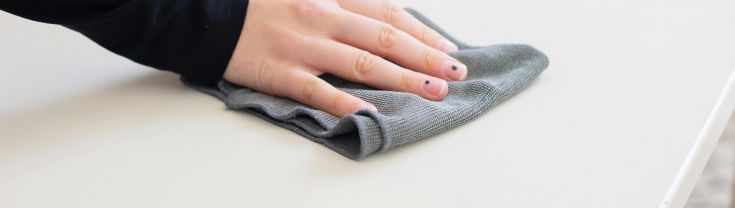 wiping table with a cloth